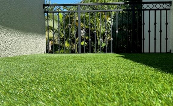 Close-up view of Evergreen Tech artificial grass showing realistic green turf texture and durable fibers.