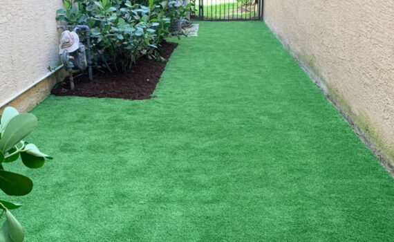 Artificial grass landscaping in West Palm Beach with realistic synthetic turf installed by Evergreen Tech.