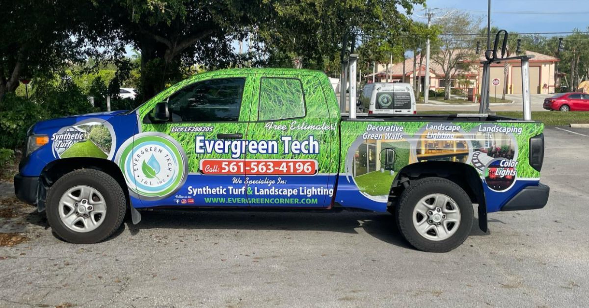 Happy dog sitting on clean artificial grass after turf cleaning in Florida.